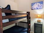 Twin over Twin bunk bed in semi-private Den with curtain. 